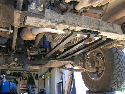 2002 GMC Yukon - This image shows the underside of a vehicle, focusing on the drivetrain and suspension components.