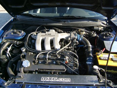 1996 Ford Probe - Engine bay of a Mazda MX-6, a V6 engine and "mx6.com" branding.