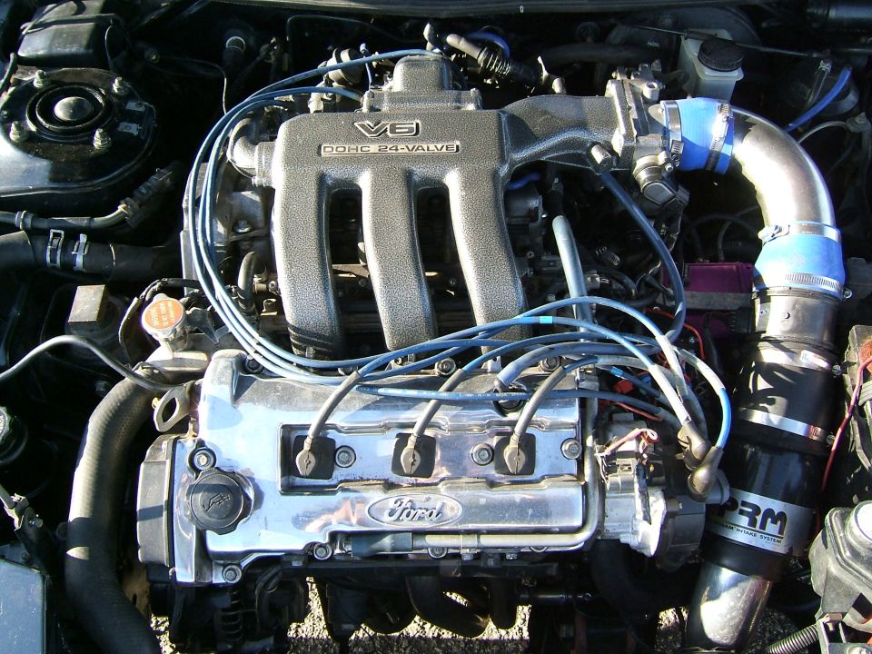 Ford V6 DOHC 24-valve engine with chrome valve covers and PRM intake system