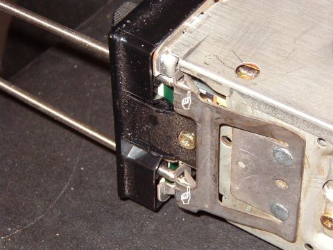1983 Ford Bronco - As the tool is inserted, the tapered tip rides up the ramp of the clip, compressing the spring & drawing the catch inward.