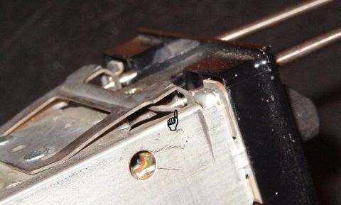 1983 Ford Bronco - As the tool is inserted, the tapered tip rides up the ramp of the clip, compressing the spring & drawing the catch inward.