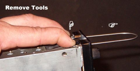 1983 Ford Bronco - Once the radio is out, manually push the locks in to allow the tools to be extracted.
