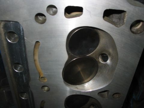 1985 Ford Crown Victoria LTD - Close-up view of an engine cylinder head, showing the intake and exhaust ports.