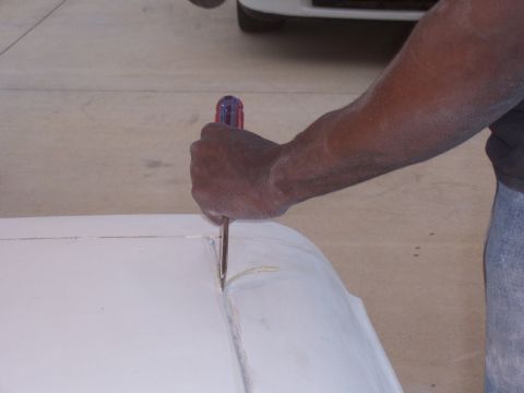 1978 Ford Bronco - Fiberglass panel being worked on with a scoring tool.