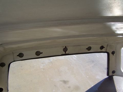 1978 Ford Bronco - Interior view of a vehicle's hardtop, focusing on the mounting points for the roof structure.