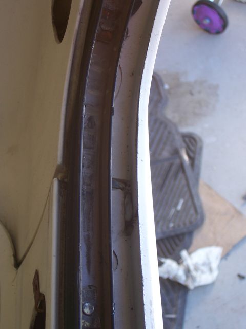 1978 Ford Bronco - Detail of the fiberglass top edge shows metal trim and mounting points.