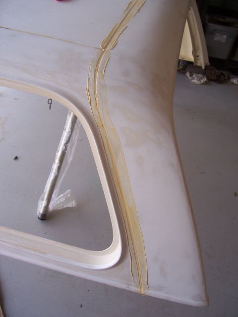 1978 Ford Bronco - A section of a fiberglass hardtop is shown with masking tape applied to a seam, suggesting repair or modification.