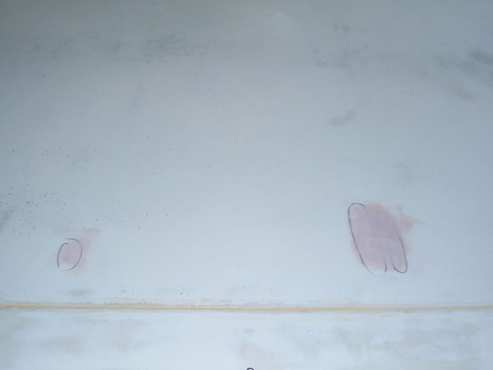 White fiberglass panel with red pencil markings and a watermark for Supermotors.net
