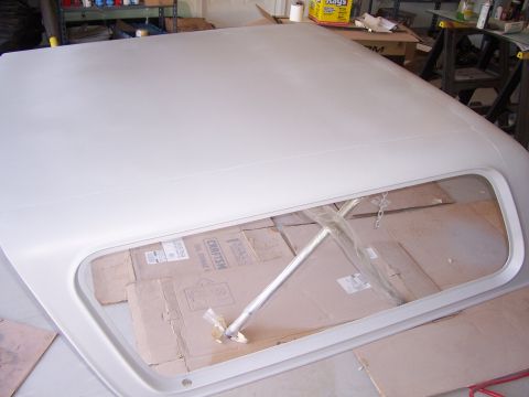 1978 Ford Bronco - A white fiberglass top for a Bronco is shown, likely in preparation for painting or repair.