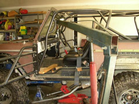 1995 Ford Bronco - This heavily modified 1978 Ford Bronco features an extensive roll cage and racing seat, suggesting off-road or competition use.