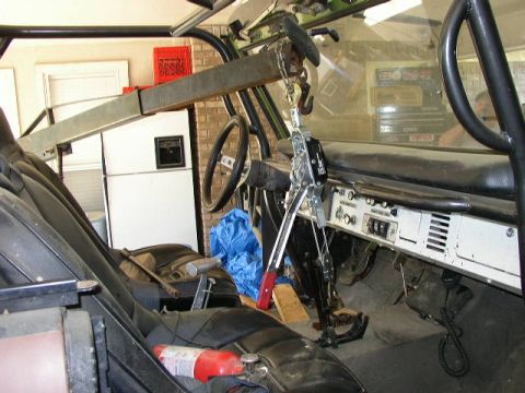 1995 Ford Bronco - Interior view of a vehicle, possibly a classic Bronco, with a hoist beam installed.