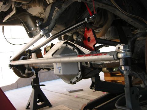 1997 Ford Ranger - Custom steering linkage and differential cover are visible on the undercarriage of a vehicle.