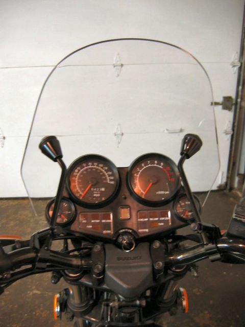 1985 Ford LTD Crown Victoria - Close-up of a motorcycle's instrument cluster and windscreen, showing gauges and controls.