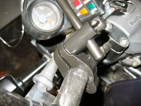 1985 Ford LTD Crown Victoria - The dashboard of a motorcycle, showing gauges and handlebar controls.