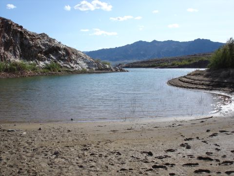1996 Ford Bronco - A scenic view of a lake surrounded by desert hills and mountains on a clear day.