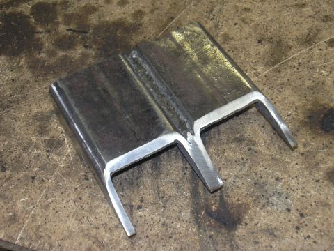 1991 Ford Bronco - Two metal components are joined by welding, forming a structural part.