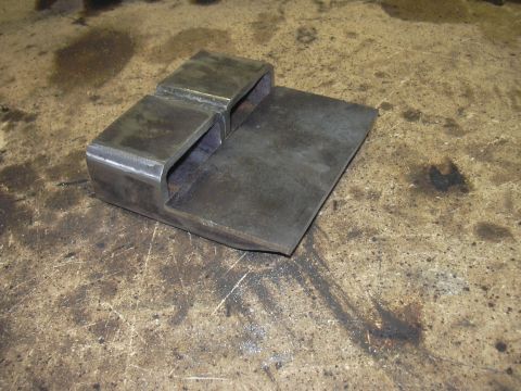 1991 Ford Bronco - A fabricated metal part, possibly a bracket or mount, with two parallel rectangular openings.