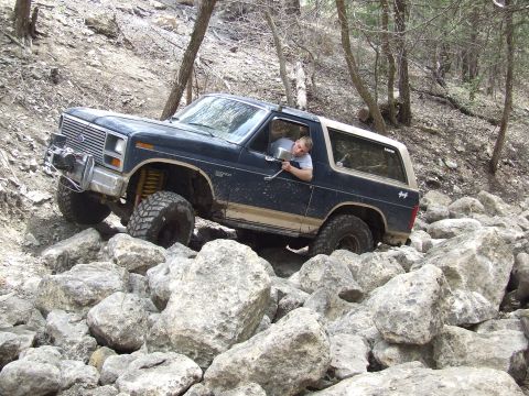 1986 Ford Bronco - This 1986 Ford Bronco is shown tackling a challenging rocky terrain.