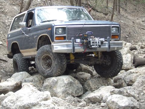 1986 Ford Bronco - This 1986 Ford Bronco is shown off-roading on a rocky trail.
