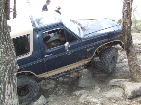 1986 Ford Bronco - This 1986 Ford Bronco tackles a challenging rock garden, demonstrating its off-road capabilities.