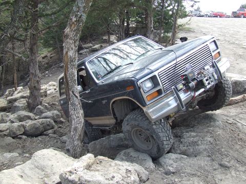 1986 Ford Bronco - This 1986 Ford Bronco is navigating a challenging rocky terrain.