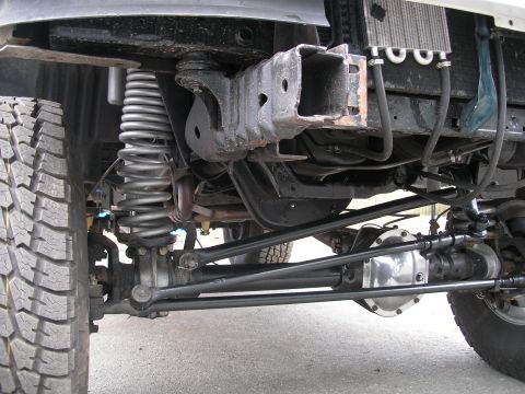 1994 Ford Bronco - Front suspension and drivetrain components are visible in this close-up shot.
