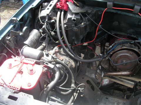 1994 Ford Bronco - View of the engine bay, showing the battery and transmission components.