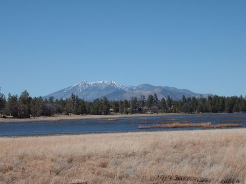 1988 Ford Bronco - A scenic view of a mountain landscape with a lake in the foreground.