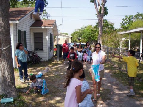 1986 Ford Bronco - A group of people, including children, are gathered outdoors for what appears to be a celebration.