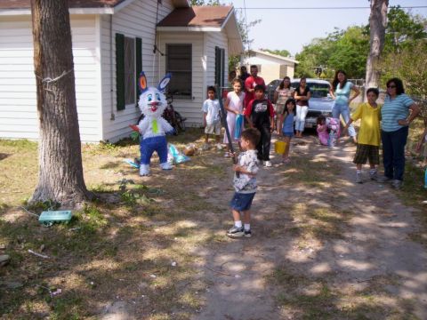 1986 Ford Bronco - A group of people, including children, are gathered for an Easter celebration with a piñata.