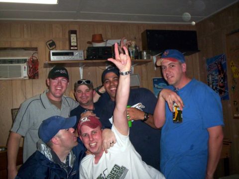 1986 Ford Bronco - A group of friends gather for a photo, some wearing baseball caps and casual t-shirts.