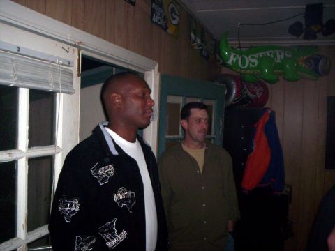 1986 Ford Bronco - Two men are standing in a room with various decorations visible on the walls and ceiling.