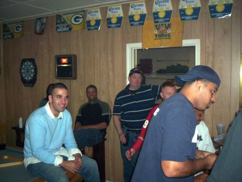 1986 Ford Bronco - A group of men are socializing in a room decorated with Corona Extra and Green Bay Packers memorabilia.
