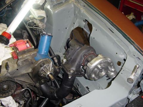 1995 Ford Mustang - The engine bay shows a newly installed turbocharger and associated piping, indicating performance modifications.