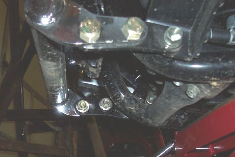 1994 Ford F-150 - The underside of a vehicle is shown, with various metal components and fasteners visible.