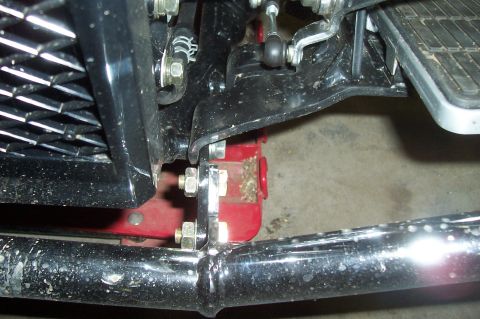 1994 Ford F-150 - Close-up view of a vehicle's front chassis components, including the grille and exhaust system.