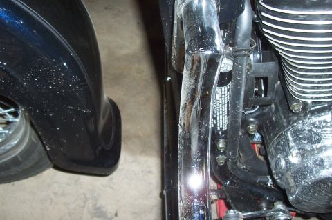 1994 Ford F-150 - Detail of a motorcycle's engine and frame components, with a portion of the front fender visible.