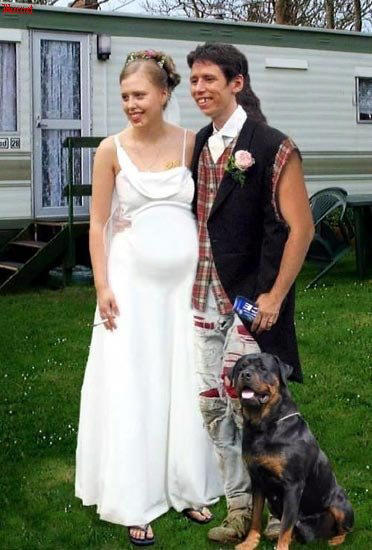 1986 Ford Bronco - A wedding party poses for a photo with their dog in front of a trailer.