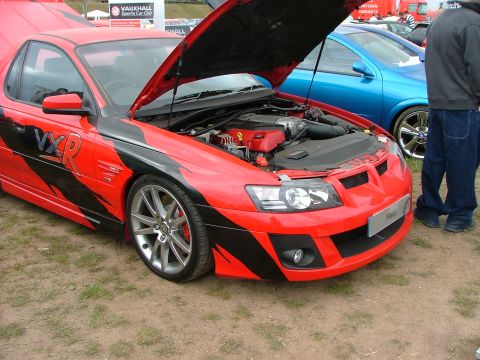 2001 Ford Fiesta - A red VXR performance car is displayed with its hood open, revealing the engine compartment.