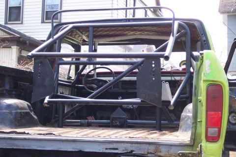 1978 Ford Bronco - Custom rollcage installed in the bed of a truck, obscuring the interior.