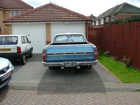 1970 Ford Ranchero - Rear view of a blue 1970 Ford Ranchero pickup truck parked in a driveway.