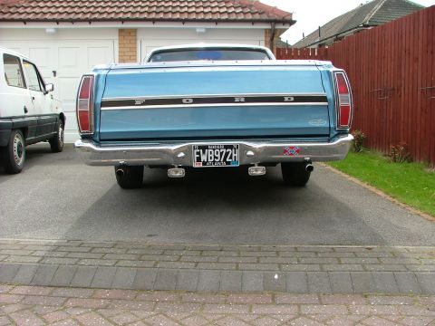 1970 Ford Ranchero - Rear view of a blue 1970 Ford Ranchero pickup truck parked in a driveway.