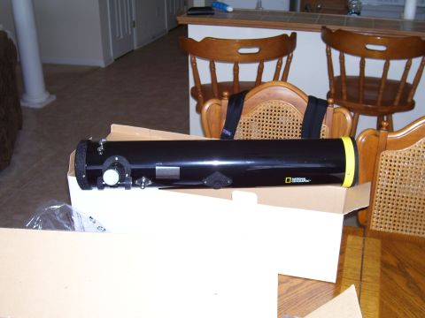 1992 Ford Bronco - A black National Geographic telescope is shown in its box, with chairs and a counter in the background.