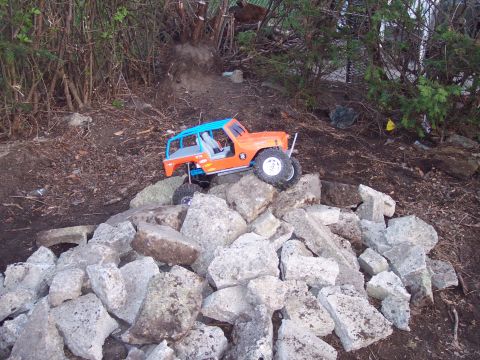 1974 Ford Bronco - RC rock crawler navigating a rocky obstacle course.