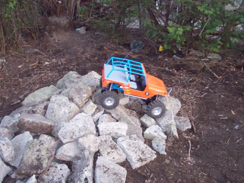 1974 Ford Bronco - A remote-controlled Jeep navigates a rocky terrain.