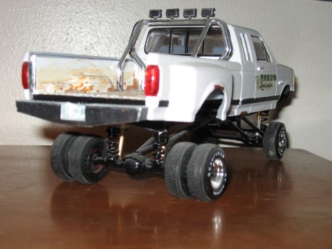 1977 Ford F-150 - This is a model truck with a custom suspension and dual rear wheels, viewed from the rear.