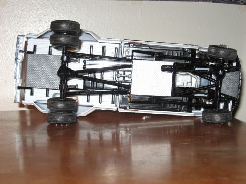 1977 Ford F-150 - Underside view of a model truck chassis, revealing its mechanical components and frame structure.