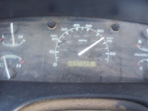 1994 Ford F-150 - A close-up of a vehicle's dashboard shows the odometer, speedometer, and other gauges.