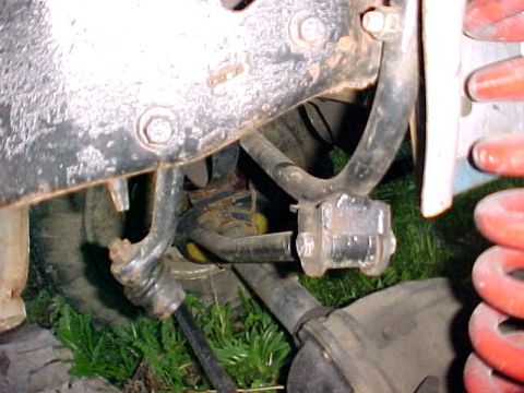 1982 Ford Bronco - This image shows a close-up view of the suspension system of a vehicle, focusing on various mechanical components.
