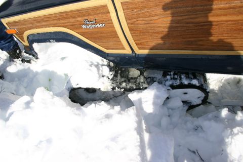 2003 Jeep TJ - Grand Wagoneer with wood paneling is stuck in deep snow.